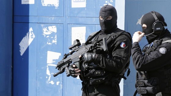 French police officers stand guard in front the jail of Sequedin near Lille, northern France 