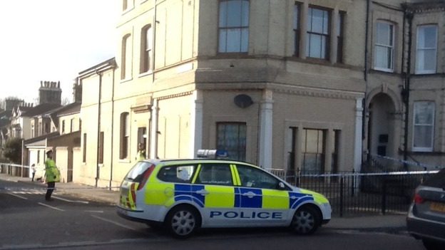 A patrol car in front of the house