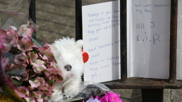 Tributes left outside the house in Lowestoft where three children were found dead.