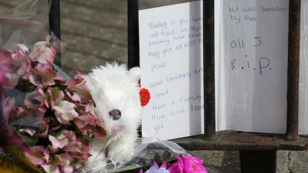 Tributes left outside the house in Lowestoft where three children were found dead.