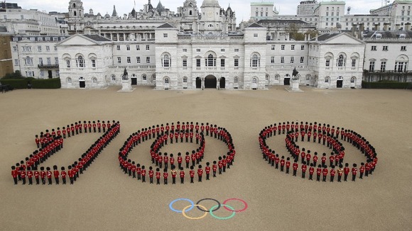 Guardsmen from the Grenadier, Coldstream, Scots and Welsh Guards mark 100 days to go at Horse Guards Parade