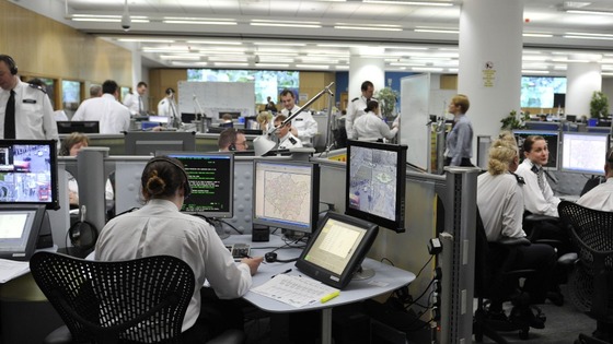 Officers watch screens at the Metropolitan Police's Specialist Operations Room in Lambeth, south London