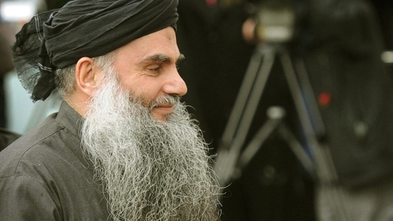 Abu Qatada arriving at his London home after leaving Long Lartin high security prison in Evesham, last year.