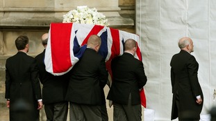 Pallbearers carry the coffin of former British prime minister Margaret Thatcher into the Palace of Westminster