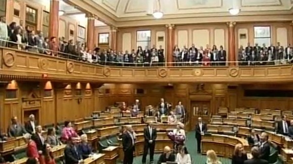 Members of the New Zealand Parliament sing after Same Sex Marriage bill passes