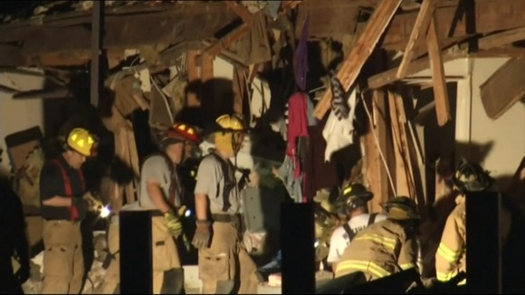 Firefighters at work in a damaged building in West, Texas