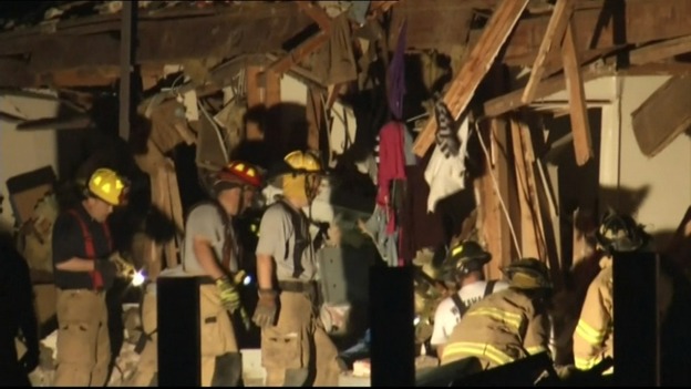 Firefighters at work in a damaged building in West, Texas