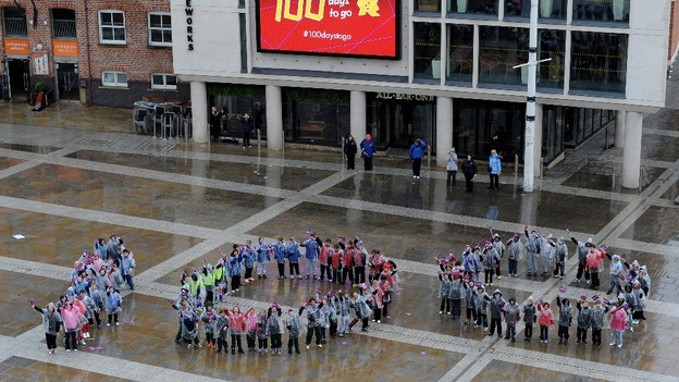 One hundred pupils from schools across Leeds form a 'human 100' in Millenium Square