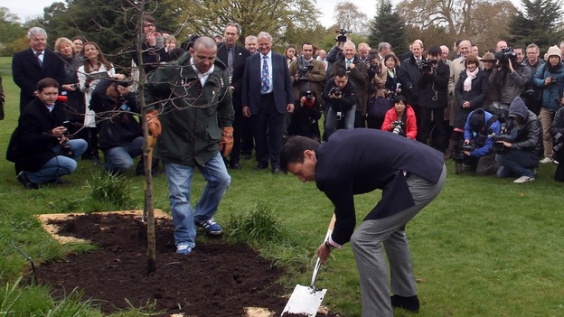 Lord Coe plants an oak tree to celebrate the UK's role in the birth of the modern Olympic movement.
