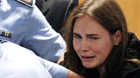 Amanda Knox reacts after her verdict in the killing of British student Meredith Kercher was announced at a court in Perugia