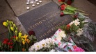 Flowers lie next to a commemorative plaque in Eltham, where teenager Stephen Lawrence was murdered in 1993.