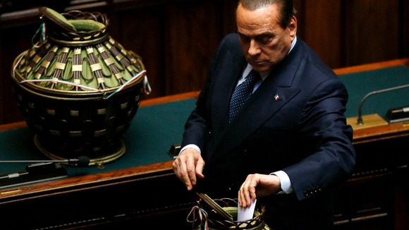 Italy's former Prime Minister Silvio Berlusconi casts his ballot during the third day of the presidential election in the lower house.