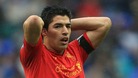Liverpool's Luis Suarez holds his head in his hands