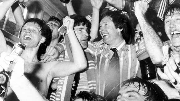 1980: Aberdeen Manager Alex Ferguson is surrounded by his players who are celebrating winning the League Title