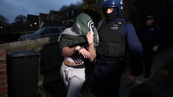 Metropolitan Police arrest a suspect after violence at the FA Cup match between Millwall and Wigan.
