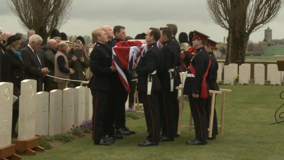 Members of the Honourable Artillery Company carry the coffin into the cemetery 