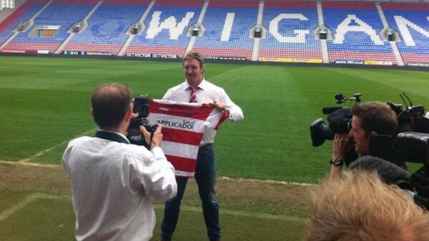 Powell with Wigan shirt