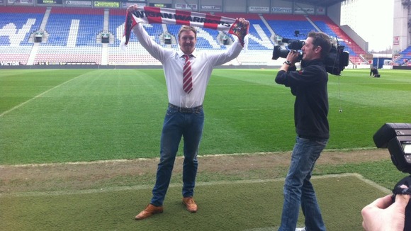 Powell with Wigan scarf
