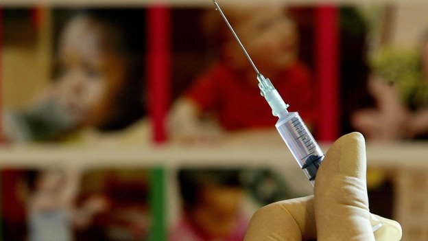 A nurse handles a syringe at a medical centre in Ashford, Kent
