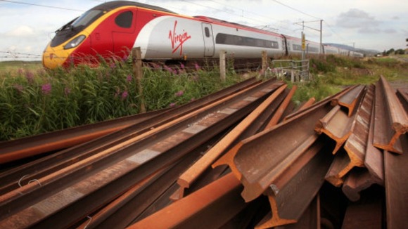 Train with rusty rails in foreground