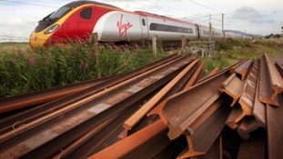 Train with rusty rails in foreground