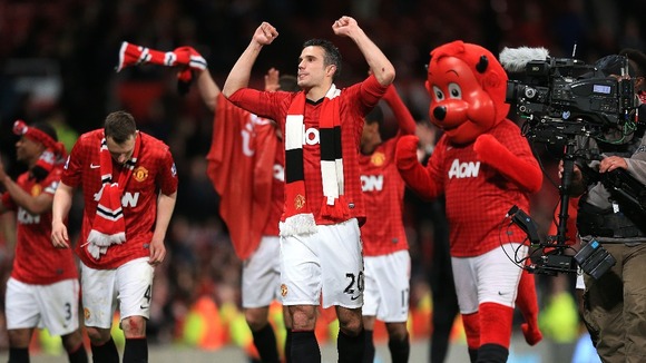 Manchester United Robin Van Persie celebrates the clubs 20th league title