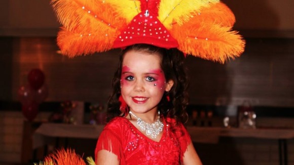 A bright outfit with feathers for Tia Woodall