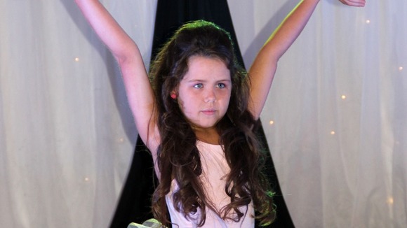 Tia Woodall strikes a pose at a beauty pageant
