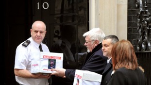 Family with boxes at no 10