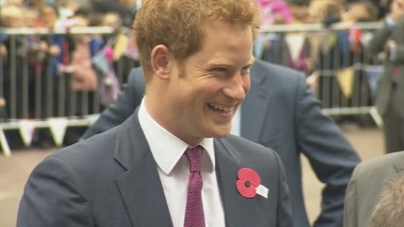 Prince Harry arrived at the opening of the new headquarters for the charity Headway wearing a poppy to commemorate Anzac Day.