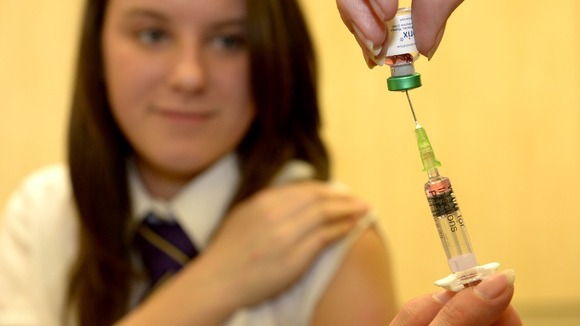 Lucy Butler, 15, prepares to get her measles jab.
