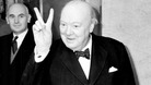 Mr Winston Churchill gives a 'victory' sign whilst on board the Cunard liner Queen Mary, on which he was sailing to New York.