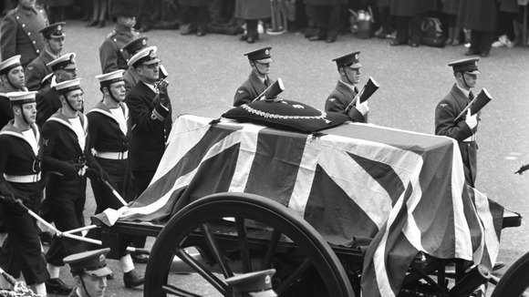 Sir Winston Churchill's flag-draped coffin on the gun-carriage in the State funeral procession.