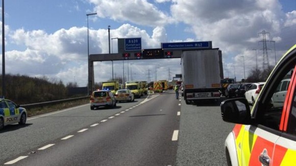 Emergency services at M62 minibus crash