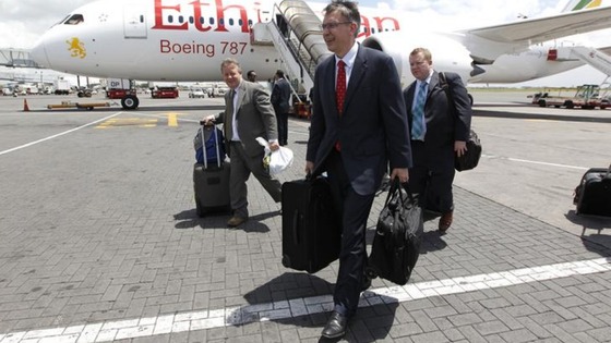 Randy Tinseth, Vice President of Marketing for Boeing (front), walks from an Ethiopian Airlines' 787 Dreamliner after it lands in Nairobi