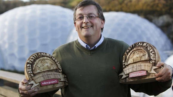 Graham Cornish showing of his World Pasty Championship trophies at the Eden Project