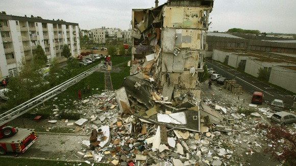 Rescue forces surround the rubble of a collapsed residential building in Reims, France.
