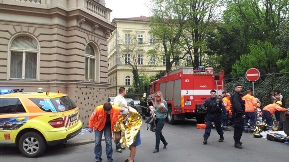 Injured people are given assistance near the scene of the blast.