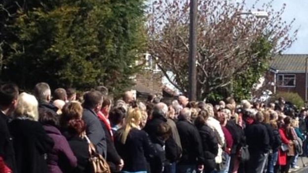 Crowds line the streets close to the church in Formby to pay their respects to Anne Wiliams.
