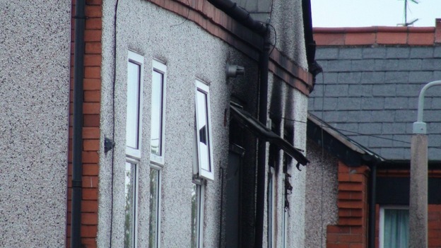 The fire damaged flat in Prestatyn, North Wales, where the family members died.