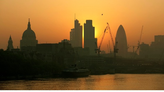 The sun rises over London's financial district