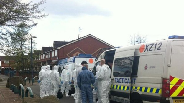 Forensic officers and Tactical Aid Units gather on an estate in Ordsall.