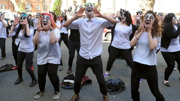 Members of the flash-mob perform outside Defra headquarters today