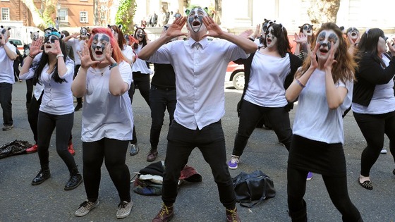 Members of the flash-mob perform outside Defra headquarters today 