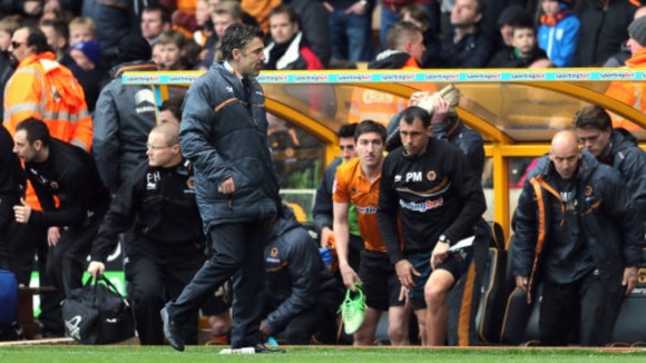 Wolves manager Dean Saunders is dejected at the final whistle after losing to Burnley