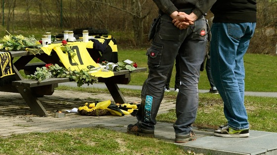 An AIK jersey and flowers lay outside the training ground in memory of the goalkeeper.