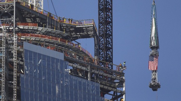 Spire makes its way past the top of the building