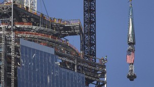 Spire makes its way past the top of the building