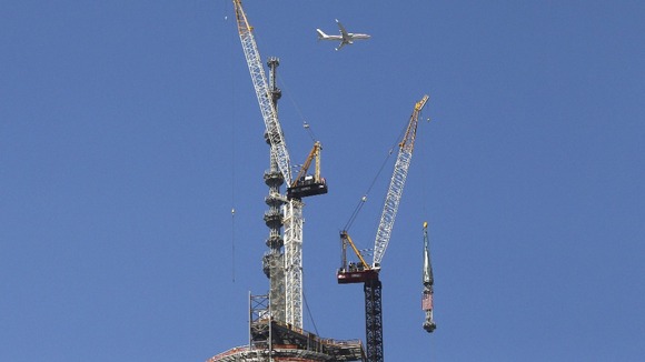 Passenger plane flies past One World Trade Centre