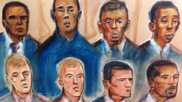 Court artist's impression of the eight defendants